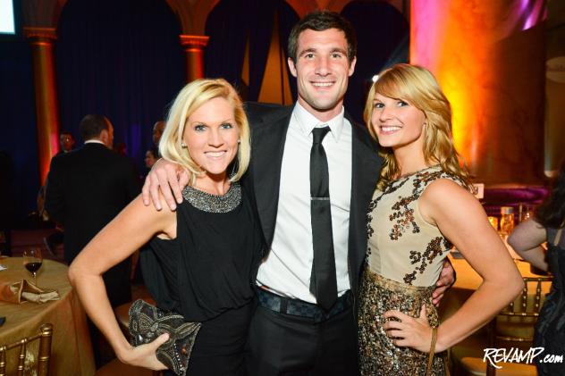 Monumental Sports' Larhonda Lombardi and Availor Philanthropy's Katherine Kennedy flank D.C. United forward Chris Pontius.